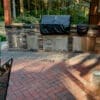 Outdoor kitchen faced with Cultured Stone on a paver patio