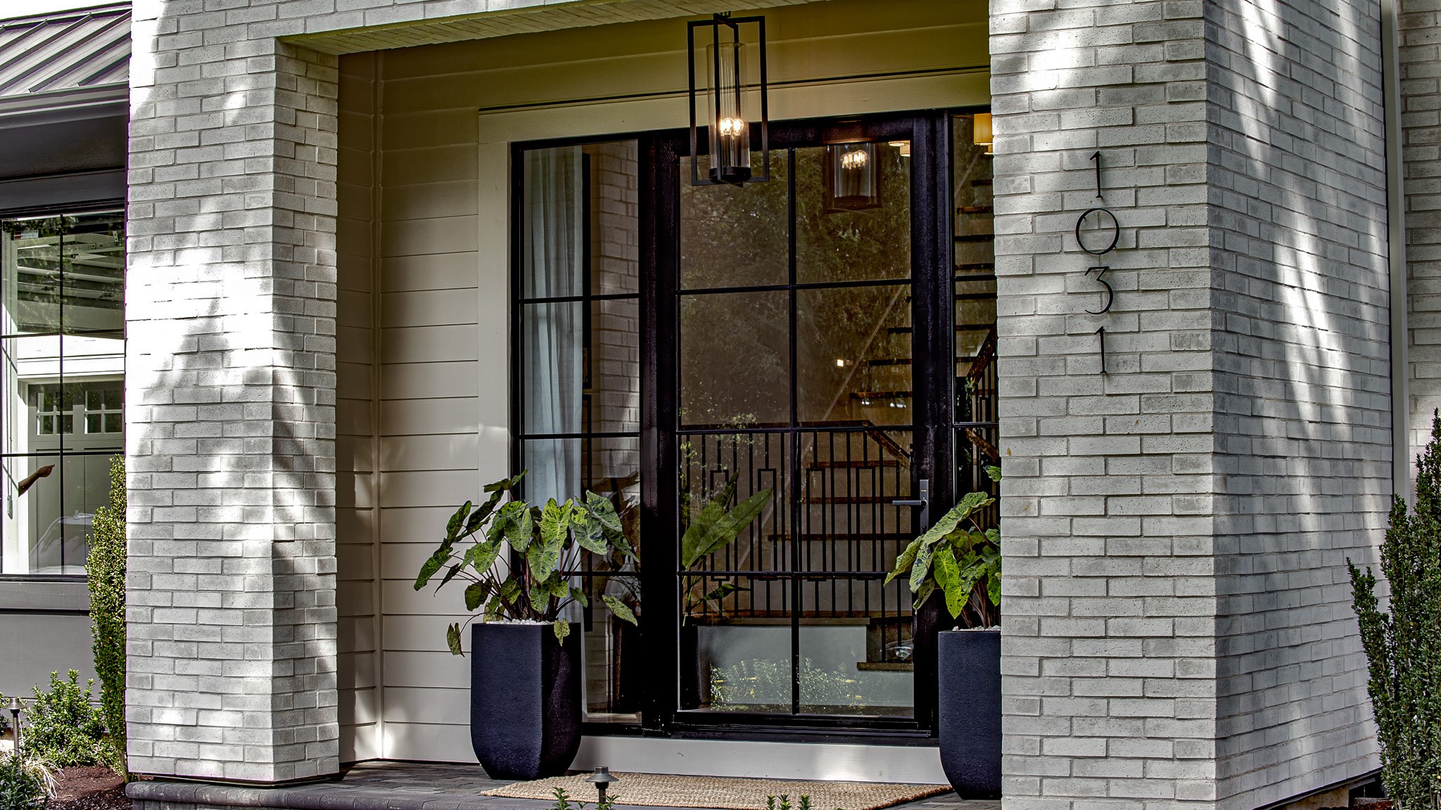 White brick was used to create this modern entryway