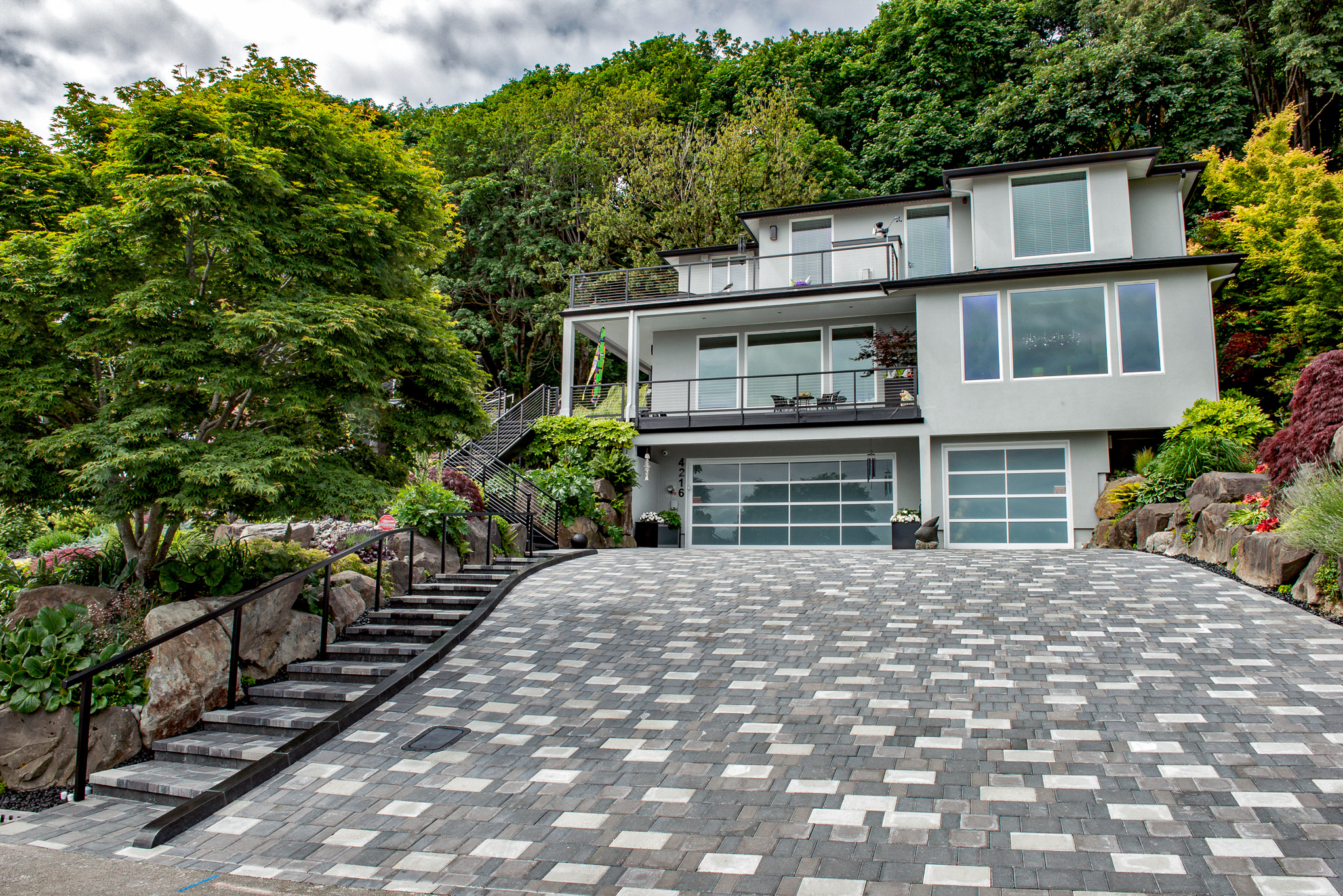 Driveway and stairs created with multi-colored pavers