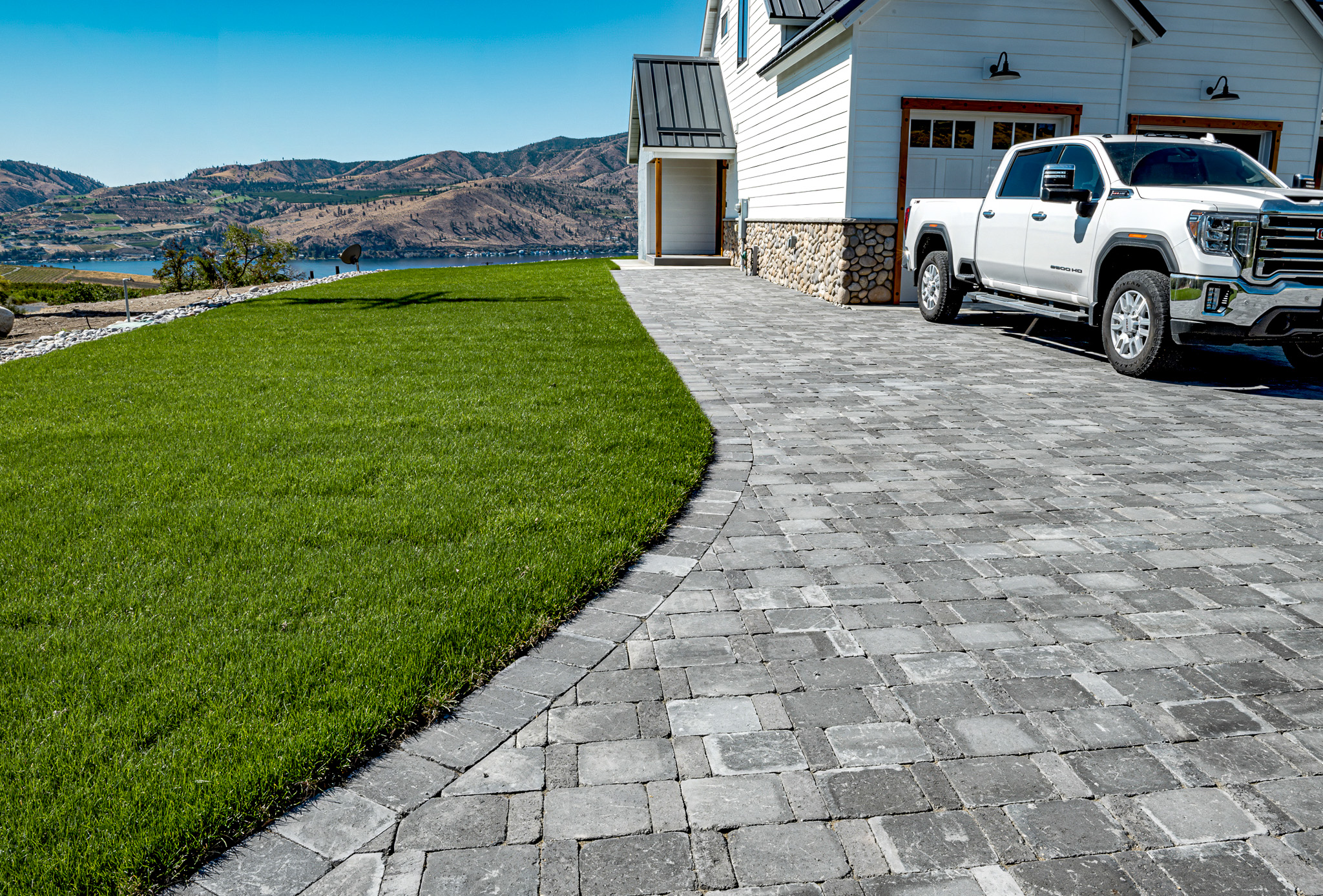 Roman Cobblestone driveway sits above Lake Chelan.